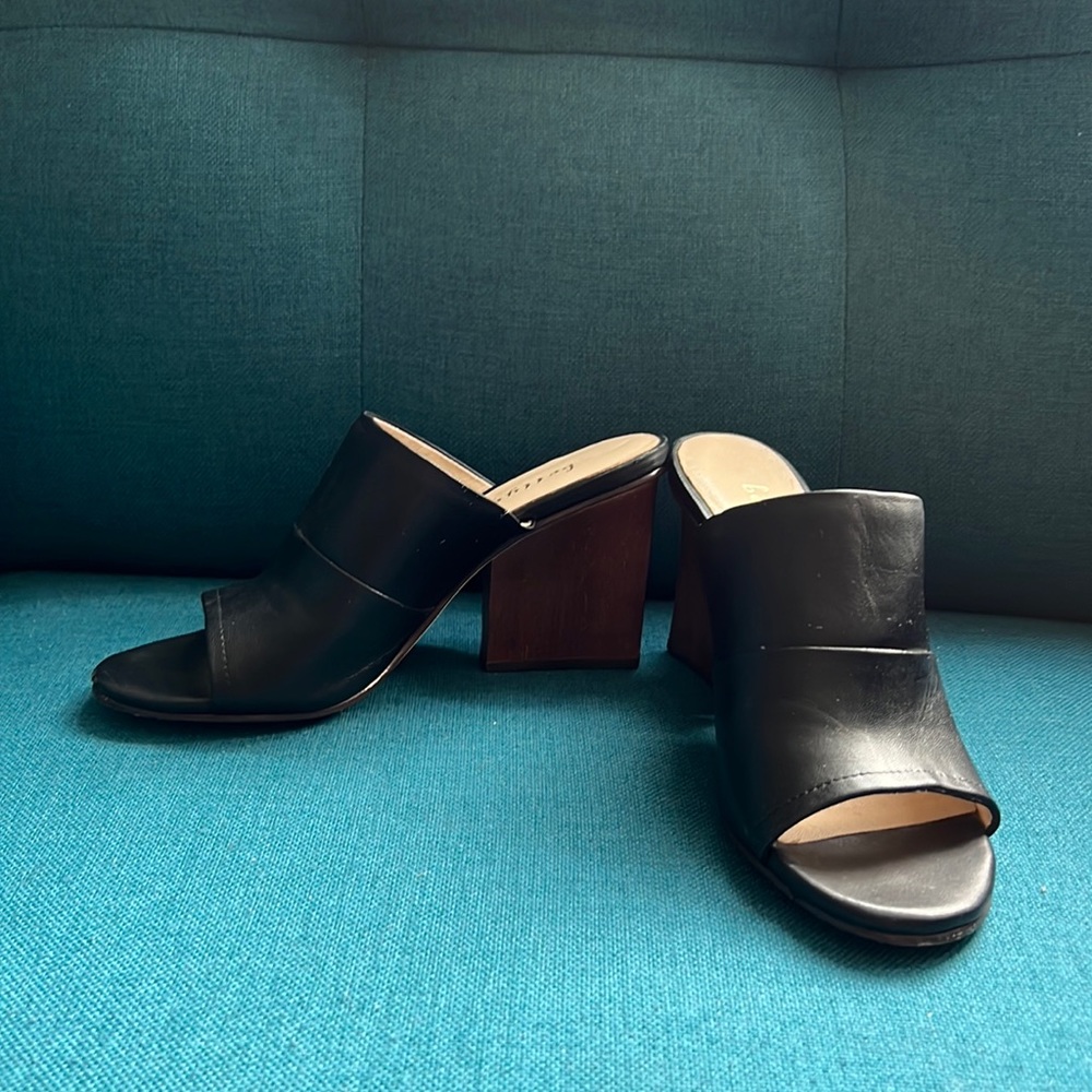 Sleek black leather Bettye Muller peep-toe mule